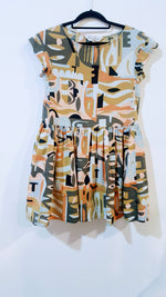 Claire Johnson + Gorman graphic camo print beach dress, in greens, oranges, and blues